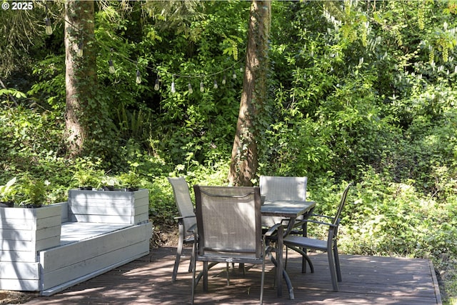 deck featuring outdoor dining space
