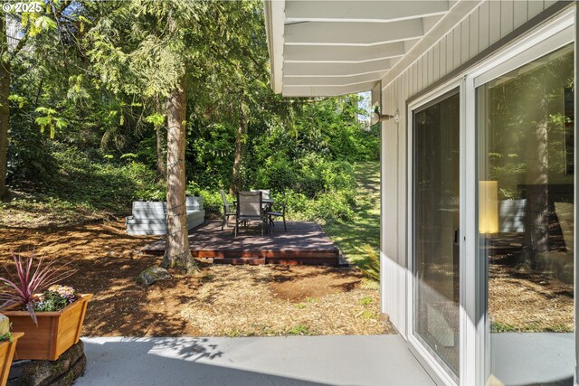 view of yard featuring outdoor dining space and a patio