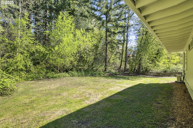 view of yard featuring central air condition unit