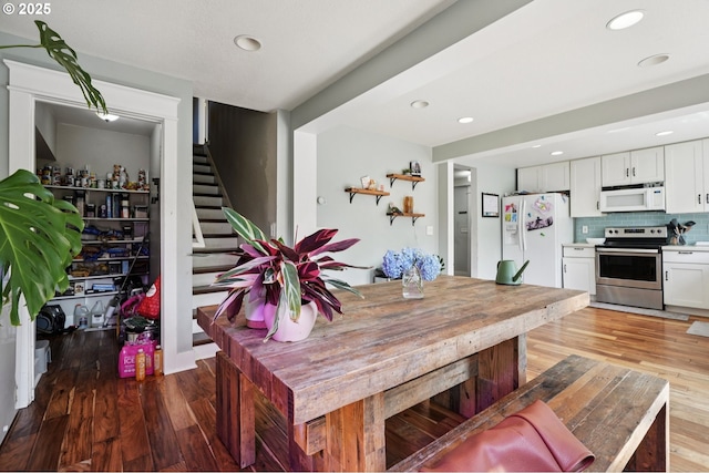 1612 12th St, Oregon City, OR 97045 - dining area with light wood-type flooring, stairs, and recessed lighting