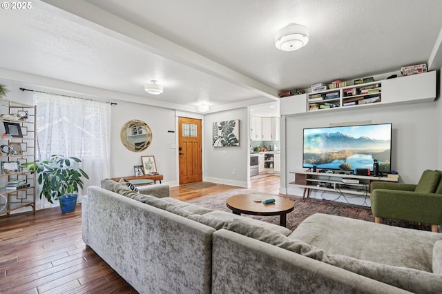 1612 12th St, Oregon City, OR 97045 - living area featuring wood finished floors, healthy amount of natural light, and a textured ceiling