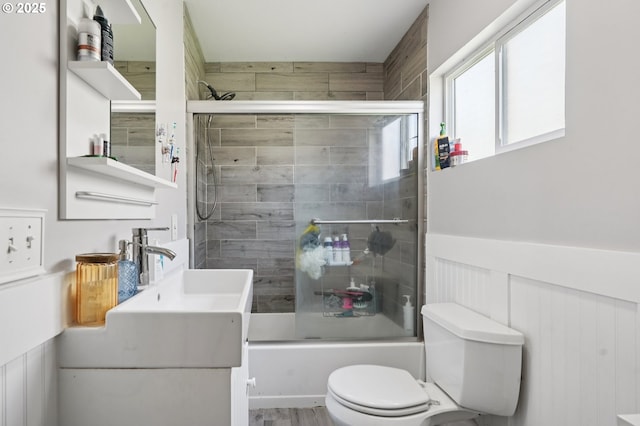 1612 12th St, Oregon City, OR 97045 - bathroom with bath / shower combo with glass door, vanity, and wainscoting