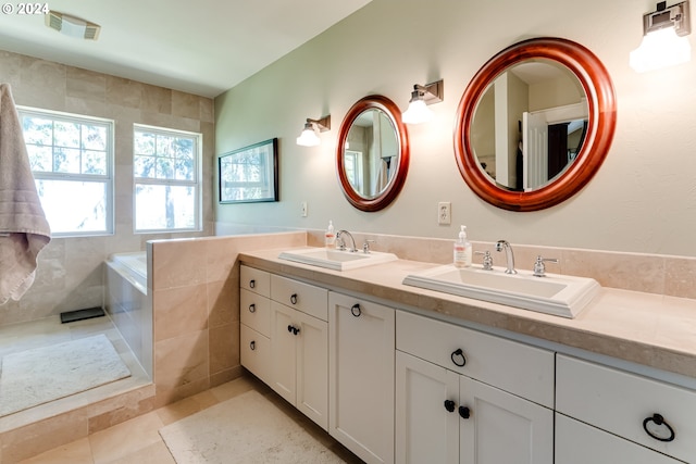 bathroom with tile patterned flooring, a sink, double vanity, and visible vents