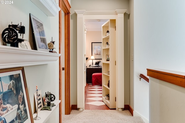 corridor with baseboards and carpet floors