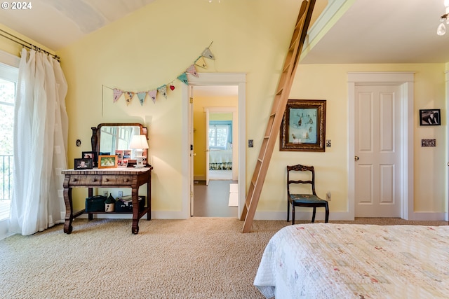 carpeted bedroom featuring baseboards