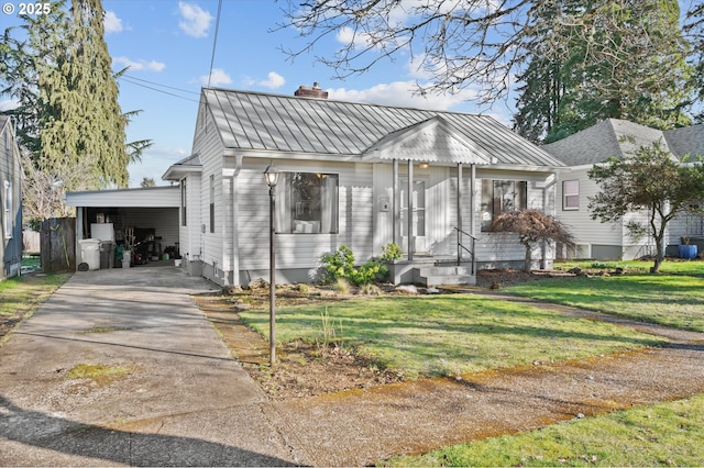 bungalow-style house featuring a carport and a front yard