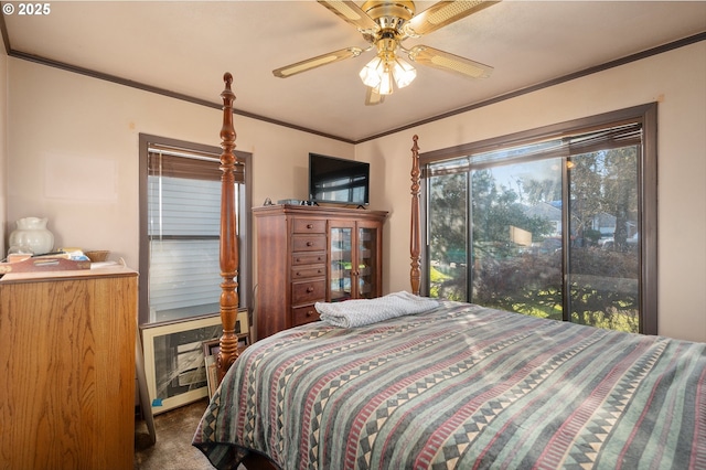 bedroom featuring ornamental molding, carpet flooring, and ceiling fan