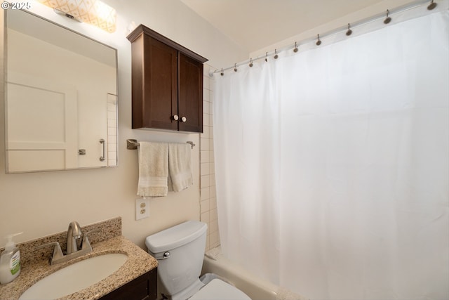 full bathroom featuring vanity, shower / tub combo, and toilet