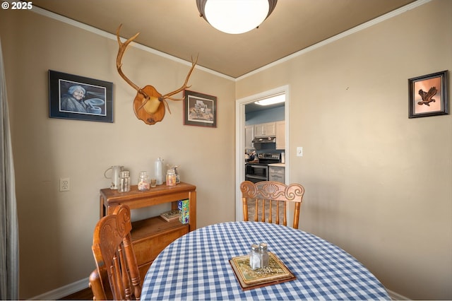 dining area featuring ornamental molding