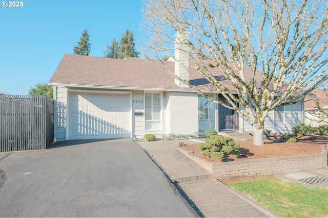 view of front of home with a garage