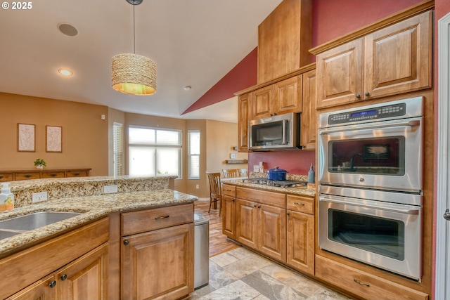 755 NW 23rd St, Pendleton, OR 97801 - kitchen featuring stainless steel appliances, light stone countertops, decorative light fixtures, recessed lighting, and lofted ceiling