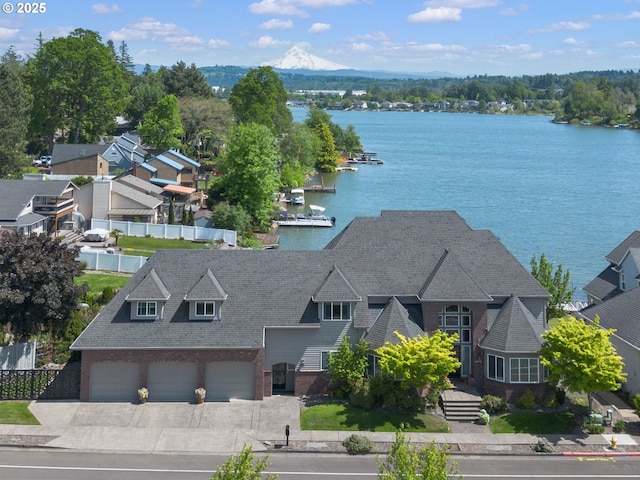 view of subject property with a water and mountain view