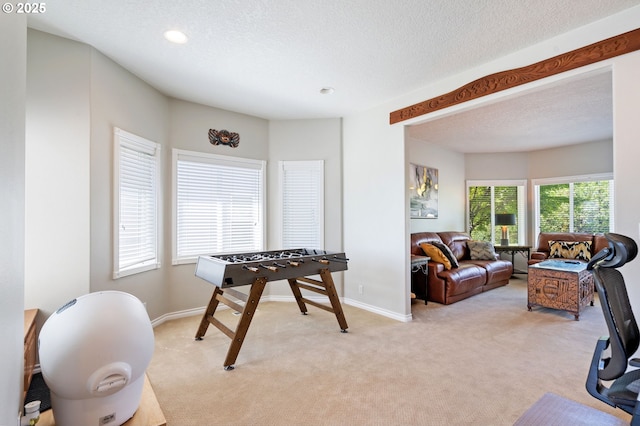 rec room featuring light colored carpet, recessed lighting, and baseboards