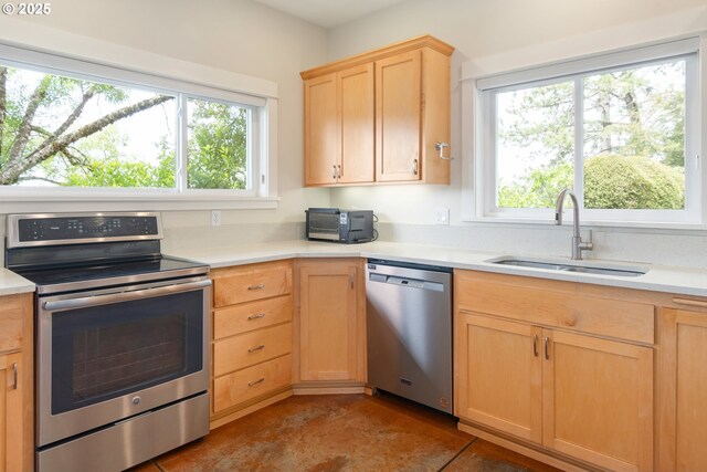 2780 Spring Blvd, Eugene, OR 97403 - kitchen with appliances with stainless steel finishes, light brown cabinets, and light countertops
