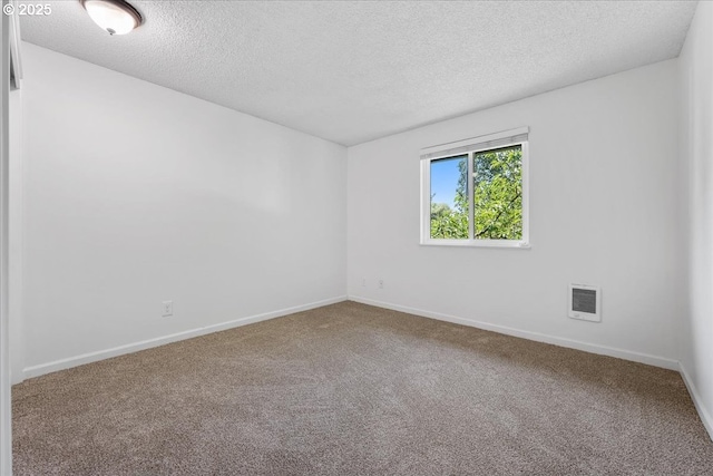 12618 NW Barnes Rd Unit 11, Portland, OR 97229 - carpeted spare room with a textured ceiling