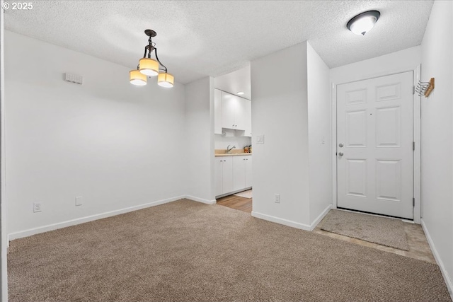 12618 NW Barnes Rd Unit 11, Portland, OR 97229 - unfurnished room featuring a textured ceiling and light carpet