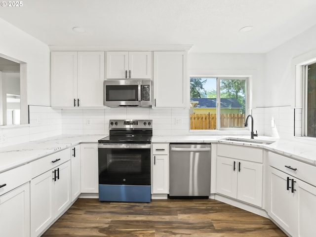 3241 SE 150th Ave, Portland, OR 97236 - kitchen featuring a sink, appliances with stainless steel finishes, tasteful backsplash, and white cabinetry