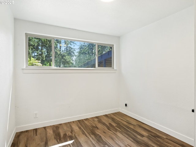 3241 SE 150th Ave, Portland, OR 97236 - empty room with baseboards and dark wood-style flooring