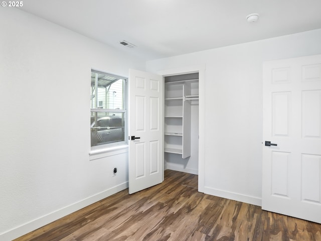 3241 SE 150th Ave, Portland, OR 97236 - unfurnished bedroom featuring baseboards, a closet, wood finished floors, and visible vents