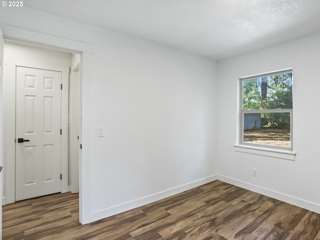 3241 SE 150th Ave, Portland, OR 97236 - unfurnished room featuring baseboards and dark wood-style floors