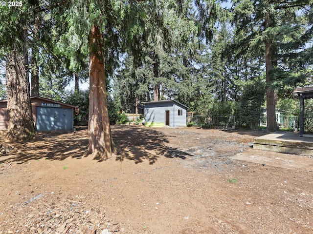 3241 SE 150th Ave, Portland, OR 97236 - view of yard with a storage unit and an outdoor structure