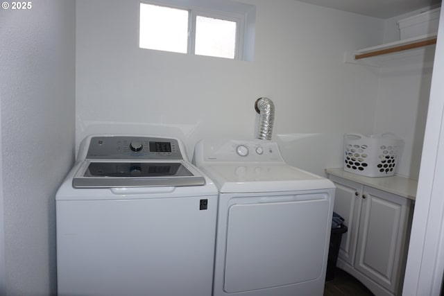 laundry area with cabinet space and washer and clothes dryer