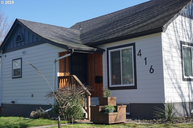 exterior space with a shingled roof