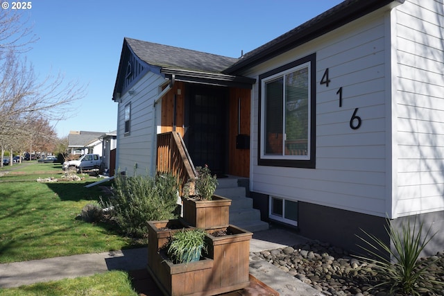 view of home's exterior featuring a lawn