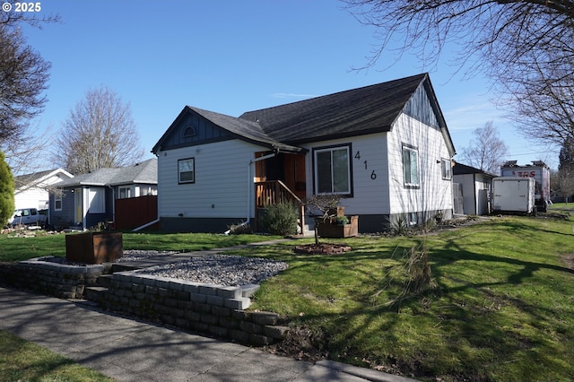 view of front of property featuring board and batten siding and a front yard