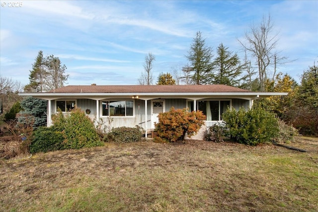 ranch-style house with a front lawn