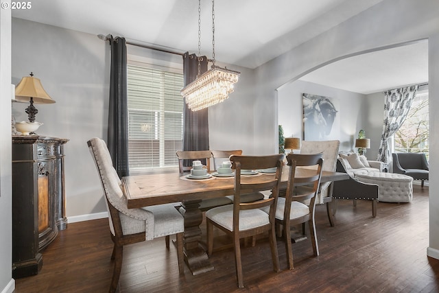 3801 NE 93rd St, Vancouver, WA 98665 - dining area featuring arched walkways, a notable chandelier, dark wood finished floors, and baseboards