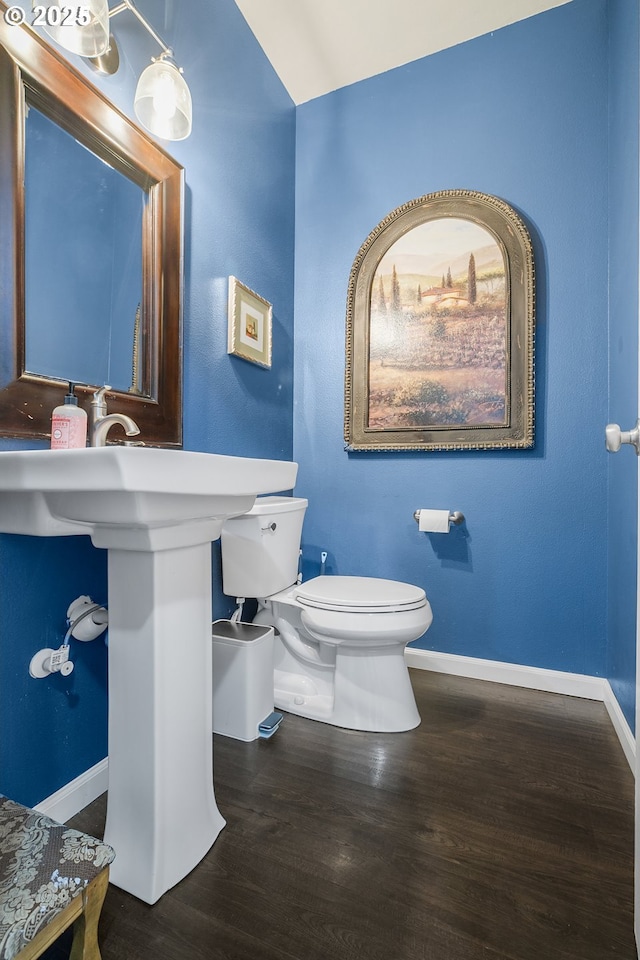 3801 NE 93rd St, Vancouver, WA 98665 - half bathroom featuring toilet, baseboards, and wood finished floors