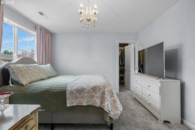 3801 NE 93rd St, Vancouver, WA 98665 - bedroom with light colored carpet, a spacious closet, visible vents, baseboards, and a notable chandelier