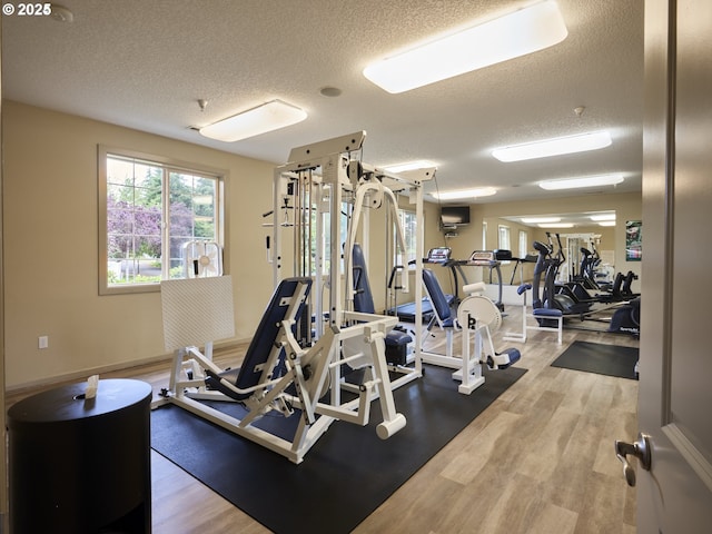 3801 NE 93rd St, Vancouver, WA 98665 - gym featuring a healthy amount of sunlight, wood finished floors, and a textured ceiling