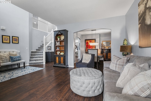 3801 NE 93rd St, Vancouver, WA 98665 - living area with dark wood-type flooring, arched walkways, baseboards, and stairs