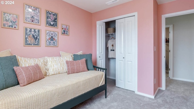 carpeted bedroom with a closet