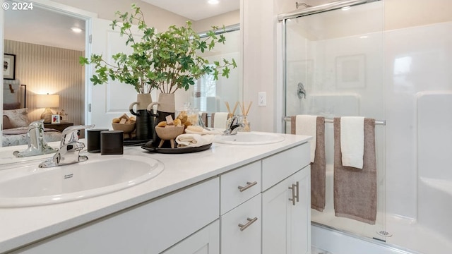 bathroom featuring vanity and a shower with shower door