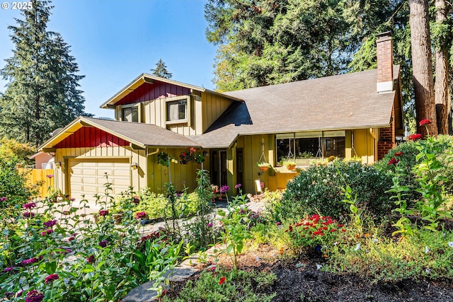 2323 Todd St, Eugene, OR 97405 - view of front of house featuring board and batten siding, an attached garage, a chimney, and a shingled roof