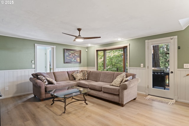 2323 Todd St, Eugene, OR 97405 - living area featuring wainscoting, light wood-style flooring, crown molding, and a ceiling fan