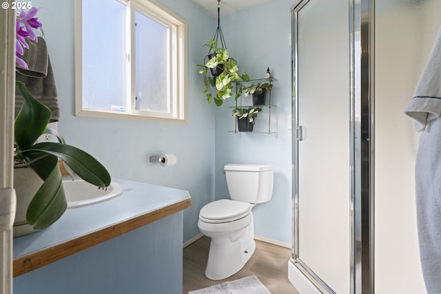 2323 Todd St, Eugene, OR 97405 - full bath with toilet, a shower stall, baseboards, wood finished floors, and vanity