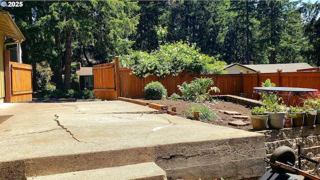 2323 Todd St, Eugene, OR 97405 - fenced backyard featuring a patio and a gate