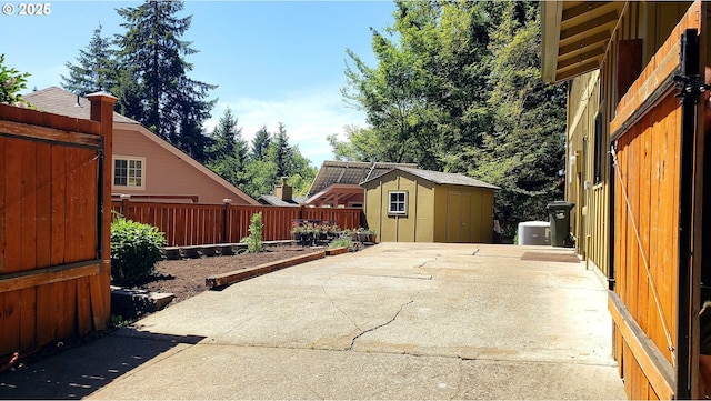 2323 Todd St, Eugene, OR 97405 - view of patio featuring a shed, an outdoor structure, and fence