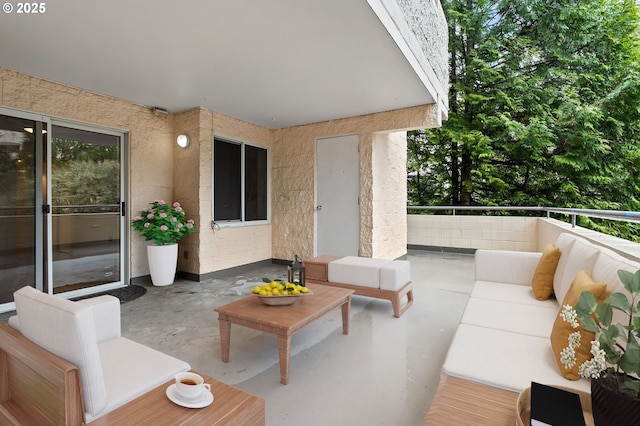 view of patio / terrace featuring an outdoor living space and a balcony