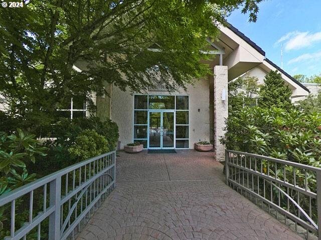 6685 W Burnside Rd Unit 310, Portland, OR 97210 - entrance to property featuring french doors and stucco siding