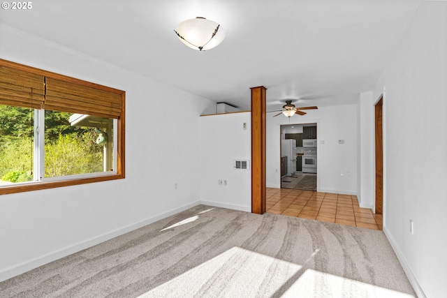 95116 Marcola Rd, Marcola, OR 97454 - carpeted spare room featuring visible vents, tile patterned flooring, baseboards, and ceiling fan