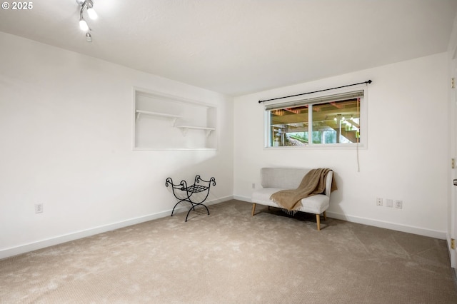 unfurnished room with carpet floors and baseboards