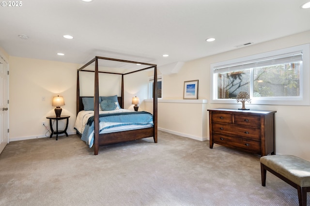 carpeted bedroom featuring baseboards, visible vents, and recessed lighting