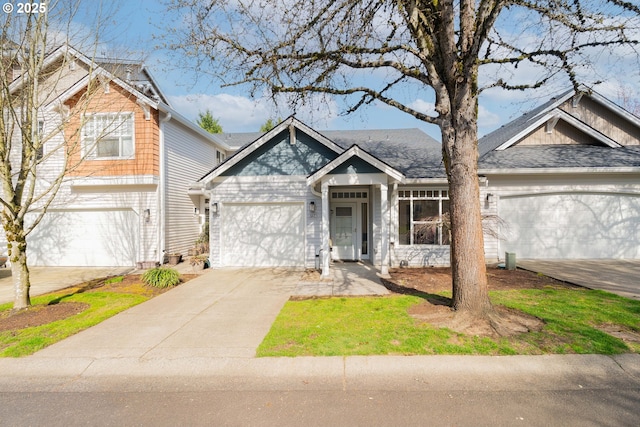 view of front of property with an attached garage and concrete driveway