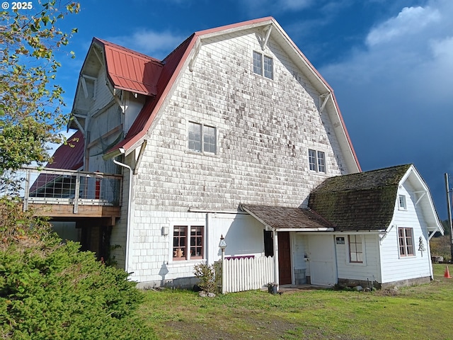 25 Fraser Rd, Tillamook, OR 97141 - back of house with a gambrel roof and a lawn