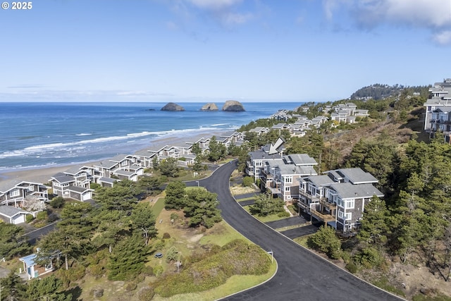 drone / aerial view featuring a water view and a residential view